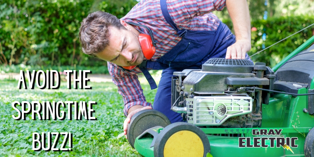 Avoid the Springtime Buzz - picture of man with safety headphones around his neck leaning over the front of a lawnmower
